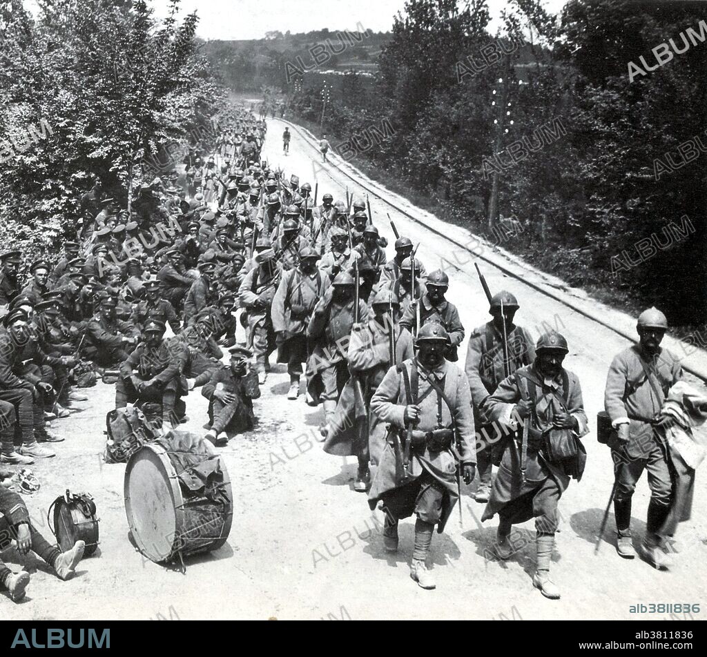 A unit of French Infantry moves up to the front line as a British band rests by the roadside. The Third Battle of the Aisne was a battle of the German Spring Offensive during WWI that focused on capturing the Chemin des Dames Ridge before the American Expeditionary Force could arrive completely in France. It was one of a series of offensives, known as the Kaiserschlacht, launched by the Germans in the spring and summer of 1918. Victory seemed near for the Germans, who had captured just over 50,000 Allied soldiers and well over 800 guns by May 30, 1918. But after having advanced within 35 miles of Paris in early June, the German armies were beset by numerous problems, including supply shortages, fatigue, lack of reserves and many casualties. Following many successful Allied counter-attacks, the German advance halted on the Marne. The French had suffered over 98,000 casualties and the British around 29,000. German losses were nearly as great if not slightly heavier.