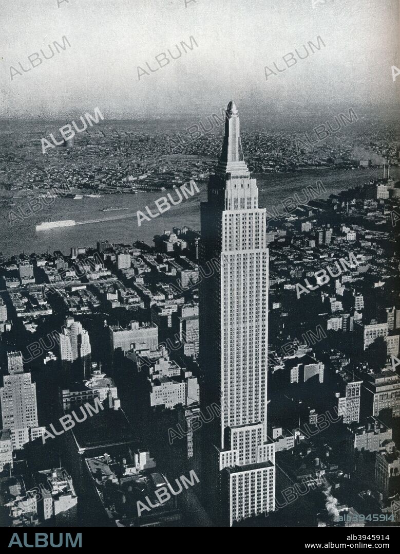'A superb photograph of the World's tallest building, the Empire State, New York City', c1940. The Empire State Building, Manhattan, New York, USA. This famous Art Deco landmark, designed by Shreve, Lamb, and Harmon, was the world's tallest building when it opened in 1931. Upon the destruction of the World Trade Centre in 2001, it once more became the tallest building in New York. From The Studio Volume 120. [The Studio Ltd., London & New York, 1940].