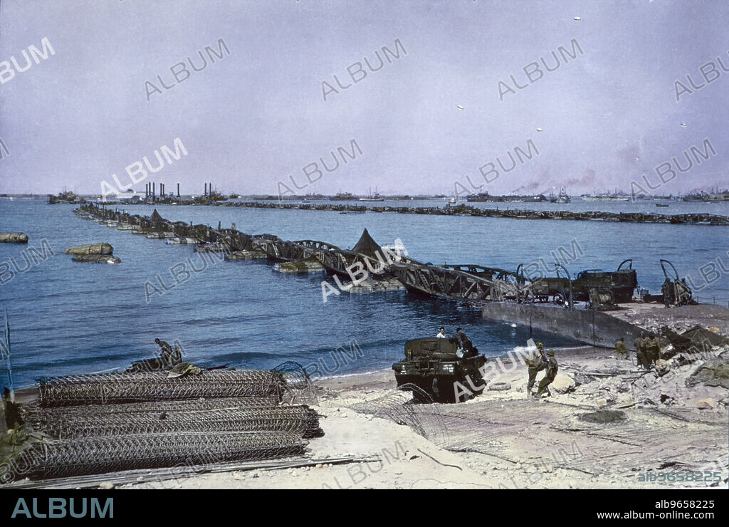 U.S. Military Vehicles crossing Pontoon Bridge to Omaha Beach from Temporary Mulberry Harbour A, Normandy, France, June 16, 1944.