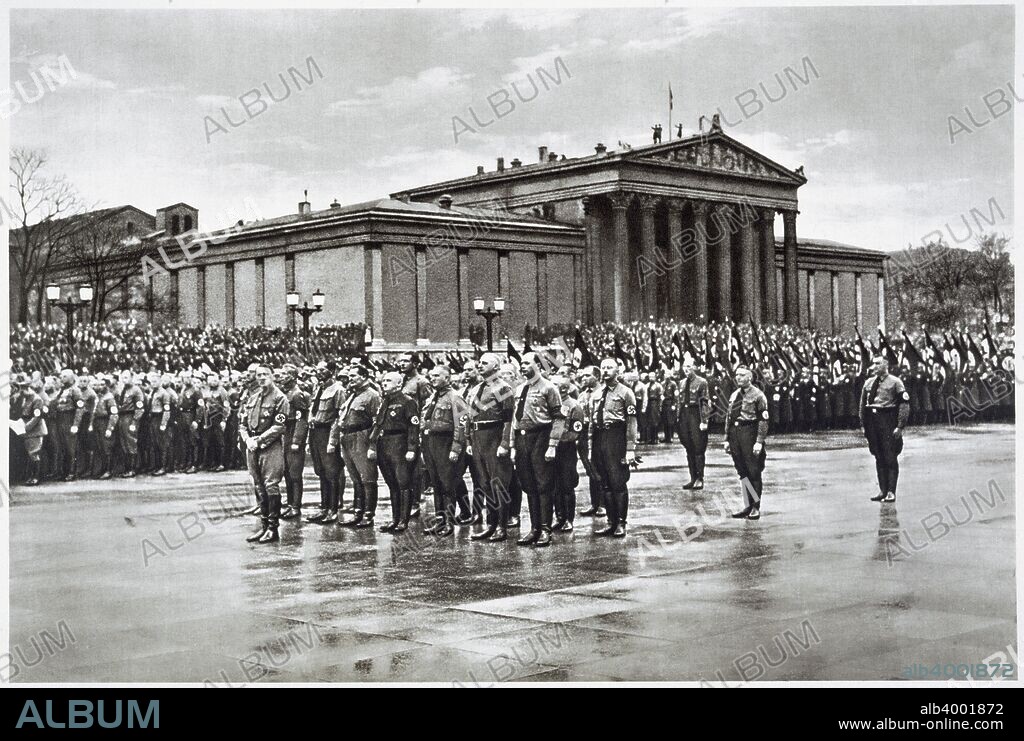 Adolf Hitler leading a procession of German World War I veterans on Martyrs' Day, 9th November 1935. From Deutsche Gedenkhalle: Das Neue Deutschland compiled by General Von Eisenhart Rothe, 1939.