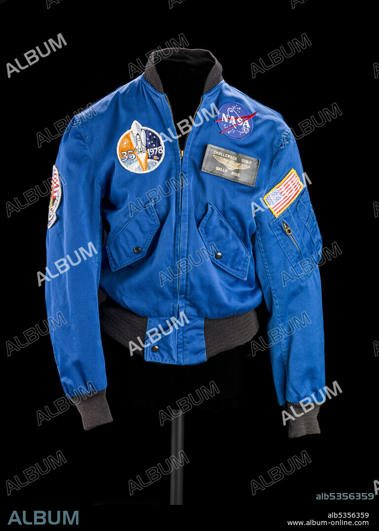 QUAL-CRAFT. Flight jacket belonging to Sally K. Ride, ca. 1983. Dr. Sally K. Ride became the first American woman in space when she flew on the STS-7 shuttle mission in 1983. Her second and last space mission was STS-41G in 1984. Shuttle astronauts wore this type of flight jacket to work and public appearances. The decorations told the individual's story. Here, the leather nametag identifies the mission on which Ride earned her astronaut wings, STS-7. The patch across the chest indicates that she was one of 35 astronauts selected in 1978 as the first group chosen for the space shuttle program. On the right shoulder is the patch for her other mission. The American flag and NASA logo patches appear on all astronaut uniforms.