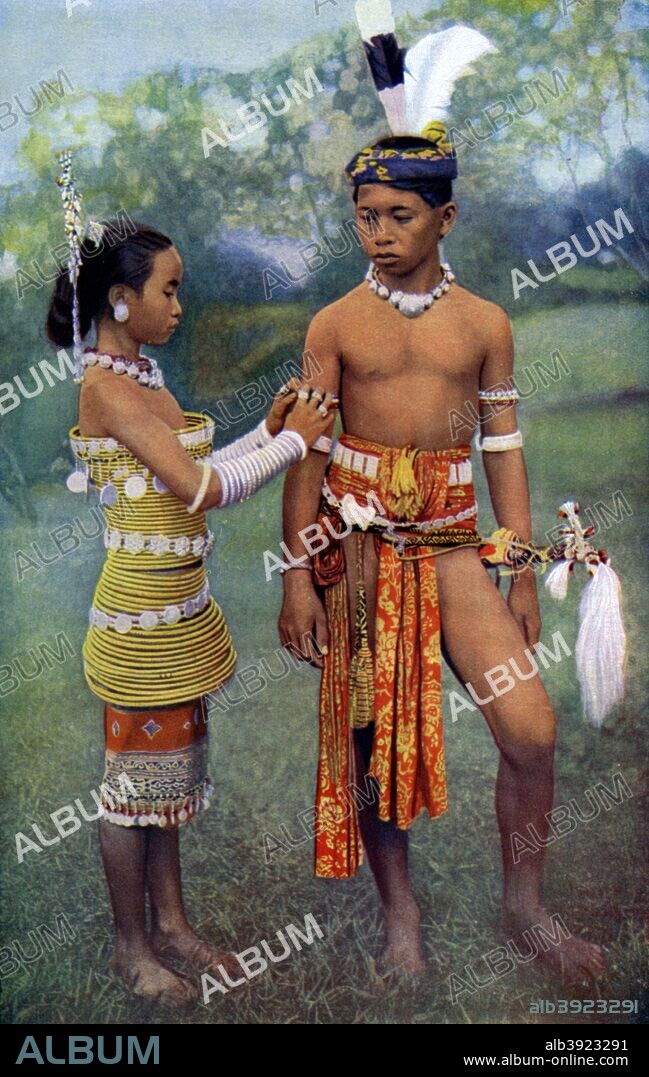 'Young Iban or Sea Dayaks people in gala attire, Borneo', 1922. Illustration from Peoples of All Nations, Their Life Today and the Story of Their Past, volume II, British Empire to Dahomey, edited by J A Hammerton, (Educational Book Co, London, 1922).