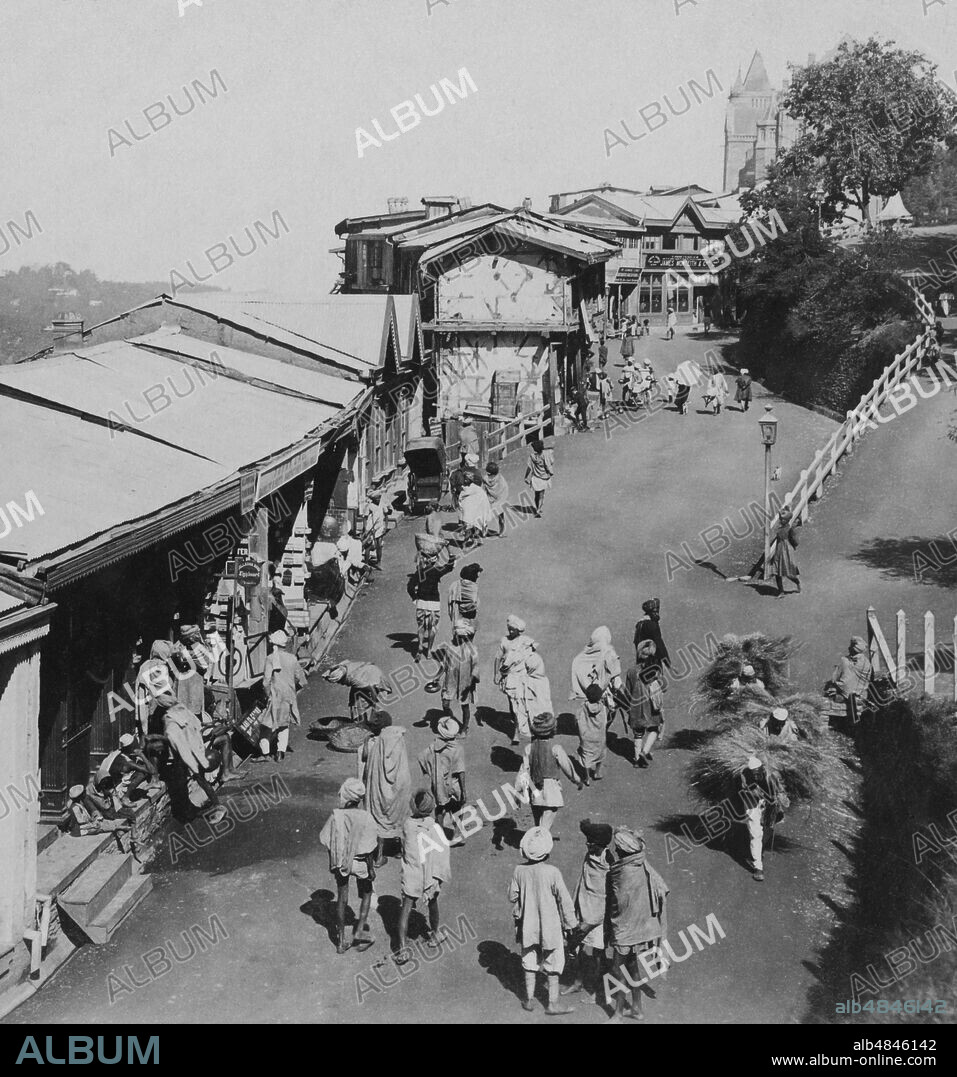 Victorian stereoview card from circa 1900 India, historic social image. Native stores and traders along lower Bazaar, Simla, the summer capita, high ridge of one of the outlying hills of the Himalayas, facing towards distant Cashmere;  Simla, India.