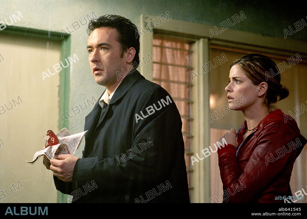 AMANDA PEET y JOHN CUSACK en IDENTIDAD, 2003 (IDENTITY), dirigida por JAMES MANGOLD. Copyright COLUMBIA PICTURES / TENNER, SUZANNE.