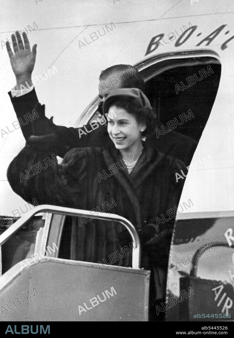 Royal Couple Leave On Commonwealth Tour *****. -- Princess Elizabeth and the Duke of Edinburgh wave goodbye from the steps of their plane at London Airport today. The King and Queen and Princess Margaret were at London Airport today to bid farewell to Princess Elizabeth and the Duke of Edinburgh who left by air for Nairobi, Kenya on the First stage of tour of Ceylon, Australia and New Zealand. January 31, 1952. (Photo by Fox Photos).