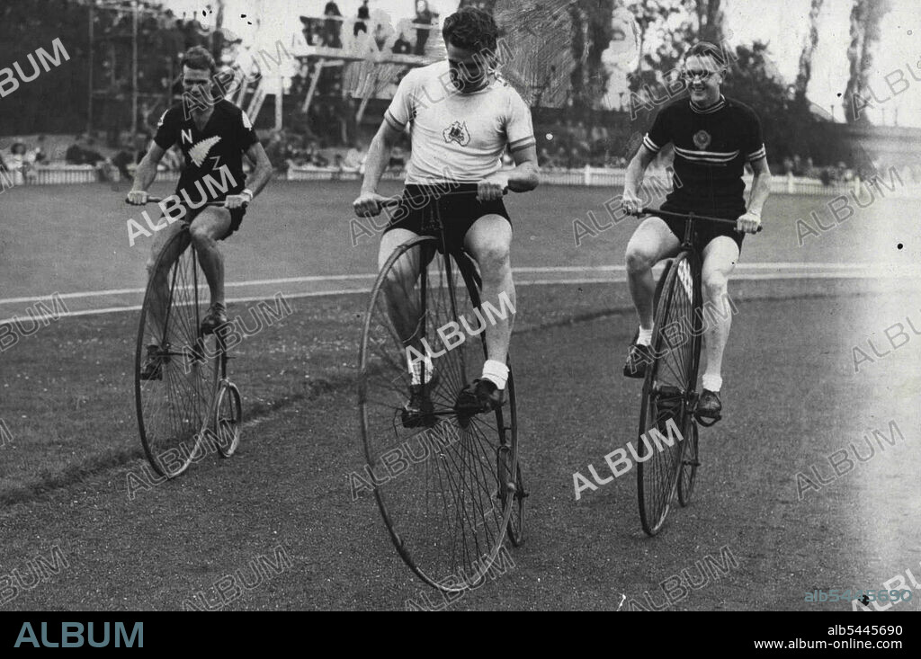 Dominion Riders Try The Old Stagers -- Sid Petterson (centre) of Australia, with A.W. Stonex and A.E. McConnell, the New Zealand riders stage an impromptu race on three of the old "Penny-farthing" cycle, during the Anniversary race meeting on the Herne Hill track, London. September 11, 1948. (Photo by Sport & General Press Agency, Limited).