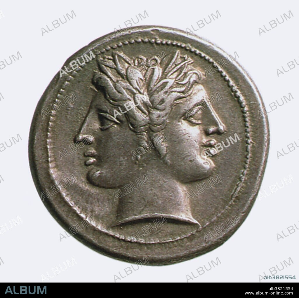 Bronze coin depicting Janus, twin-headed Roman god of beginnings and transitions, doorways and gates. Janus is also a symbol of time, looking backward to the past and forward to the future.