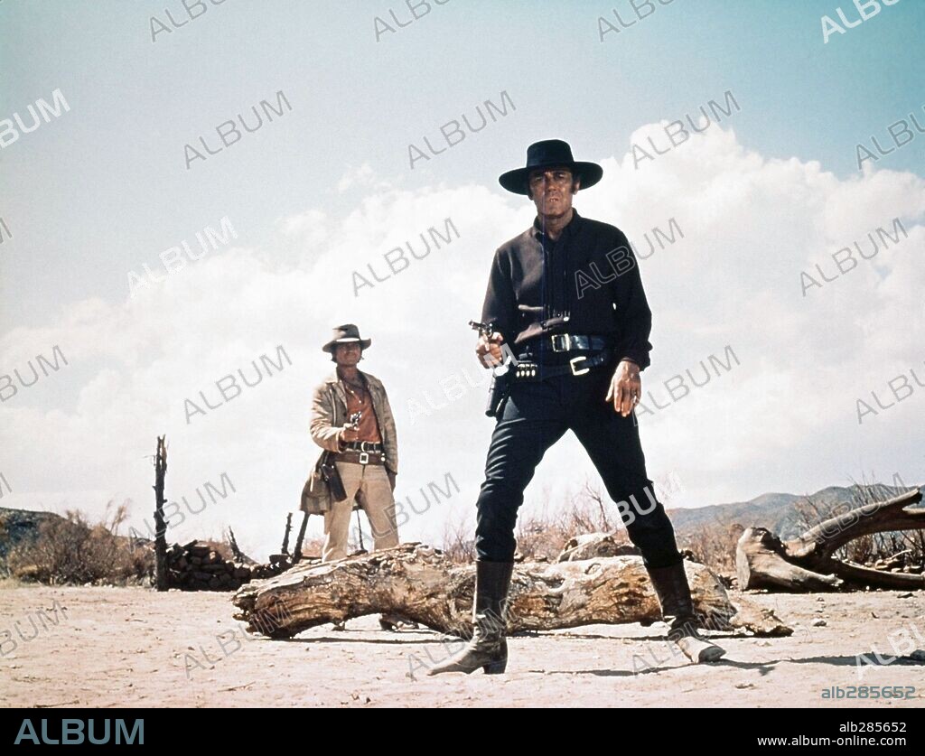 CHARLES BRONSON and HENRY FONDA in ONCE UPON A TIME IN THE WEST, 1968 (C'ERA UNA VOLTA IL WEST), directed by SERGIO LEONE. Copyright PARAMOUNT PICTURES.