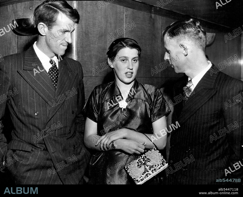 Conqueror of Mt. Everest, Sir Edmund Hillary, talks with Miss Louise Rose and his brother, Mr. Rex Hillary, at the Pickwick Club reception given by the NZ High Commissioner, Mr. G. E. L. Alderton, and Mrs. Alderton on Thursday. August 1, 1953.