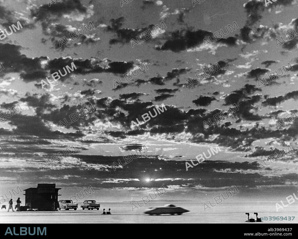 Donald Healey's Austin Healey attempting a Land Speed Record, Bonneville Salt Flats, Utah, USA, 1956. This special streamlined Austin Healey car set various speed records at Bonneville. Here it is seen passing instruments for measuring its speed.
