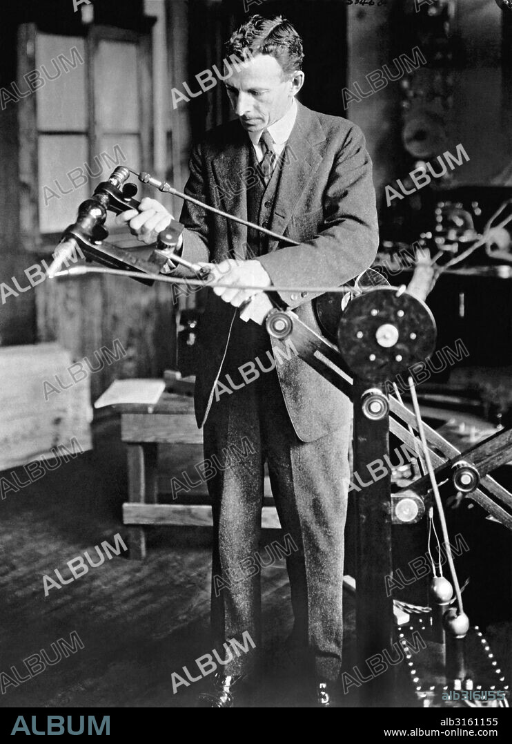 Schenectady, New York:  July 28, 1923 Dr. William D. Coolidge of the General Electric Company, inventor of the Coolidge X-Ray tube, with the newest type of tube and it's portable mechanism. July 28. 1923.