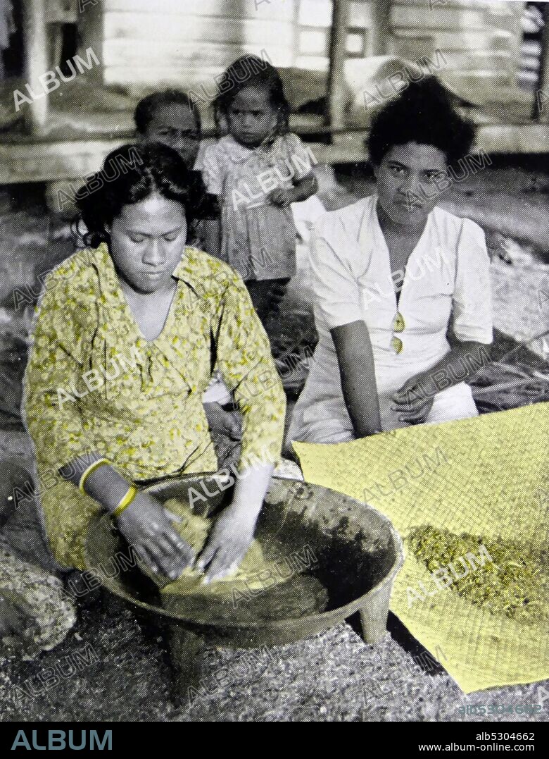 Tongan woman in traditional clothes, making Kava. 1950.