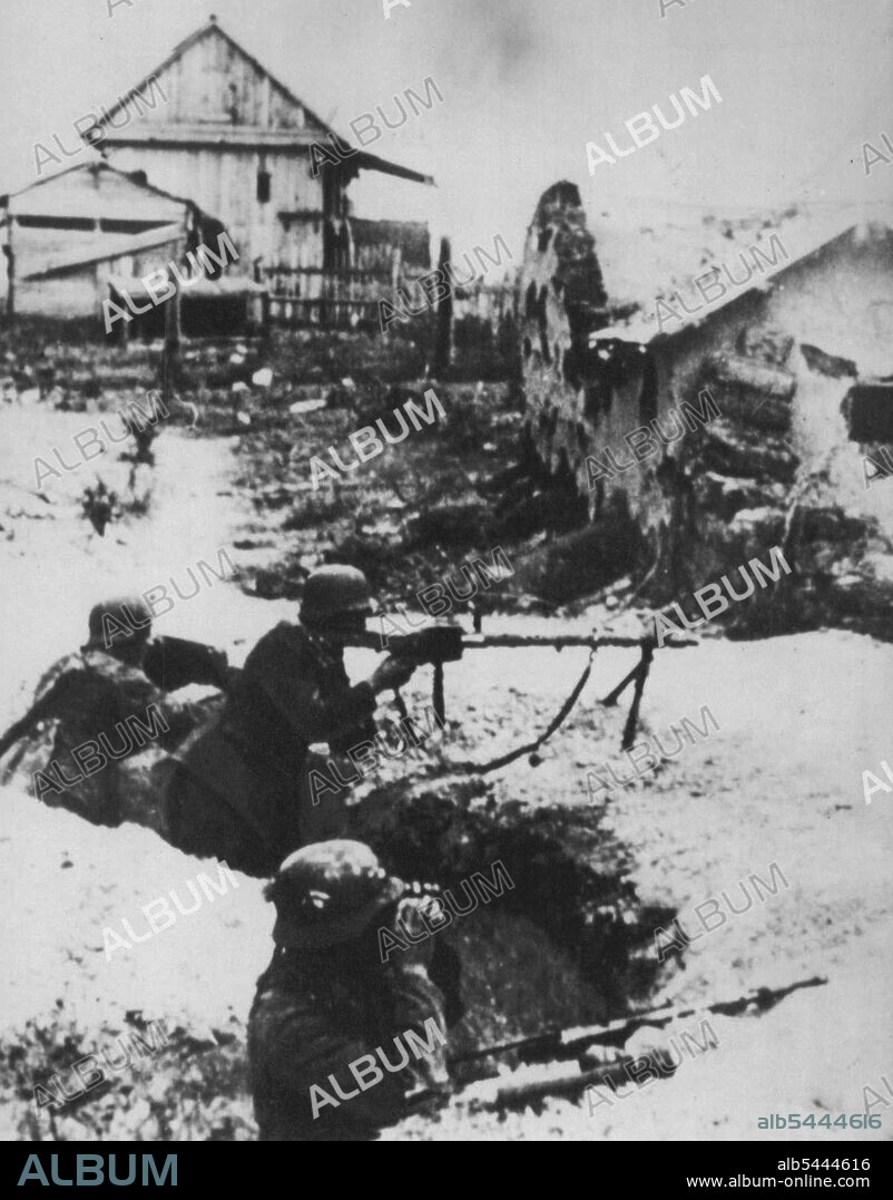 Nazis In Stalingrad -- German soldiers man a light machine gun during the street-fighting in Stalingrad. Picture came to U.S. from London. November 26, 1942. (Photo by AP Wirephoto).