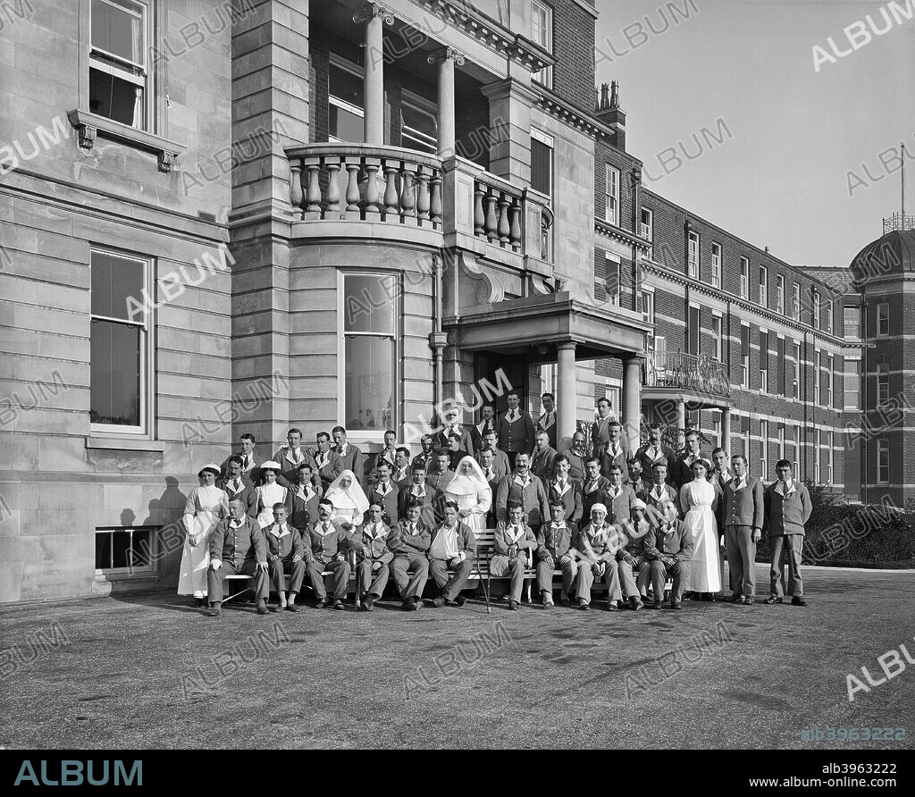 Nurses, nuns and military patients outside St Andrew's Hospital, Dollis Hill, London, October 1916.