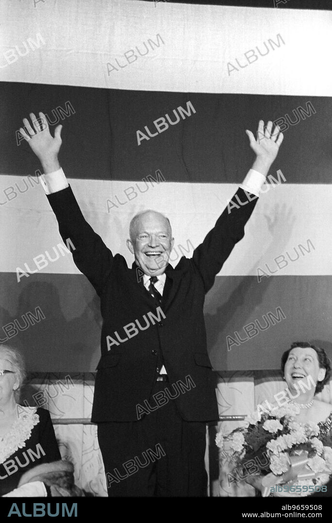 U.S. President Dwight Eisenhower with Raised Arms, First Lady Mamie Eisenhower Looking on, Election Night, November 6, 1956.