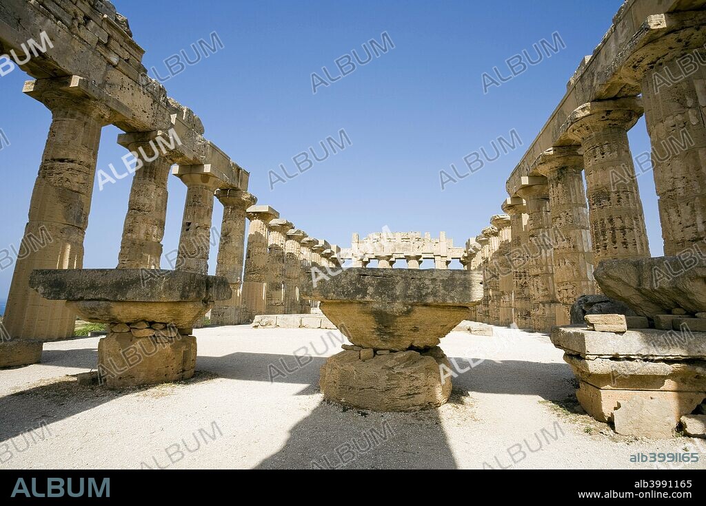 The Temple of Hera (Temple E), Selinunte (Selinus), Sicily, Italy. The present appearance of the temple is the product of recent restoration. The original building was a Doric peripteral temple with six columns in front and 15 on the sides. It was built in the first half of the 5th century BC, very probably on the site of an even more ancient construction.