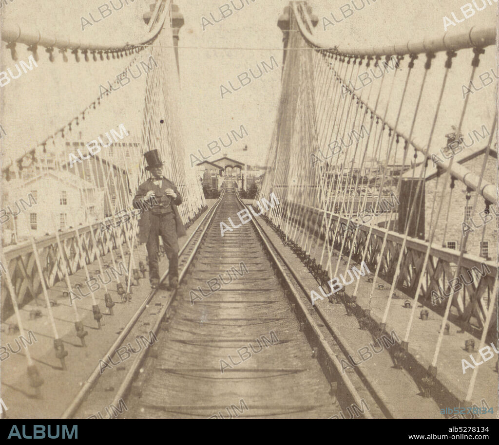 Niagara Suspension Bridge. Man in a top hat standing on railroad tracks., 1860, New York (State), Niagara Falls (N.Y. and Ont.).