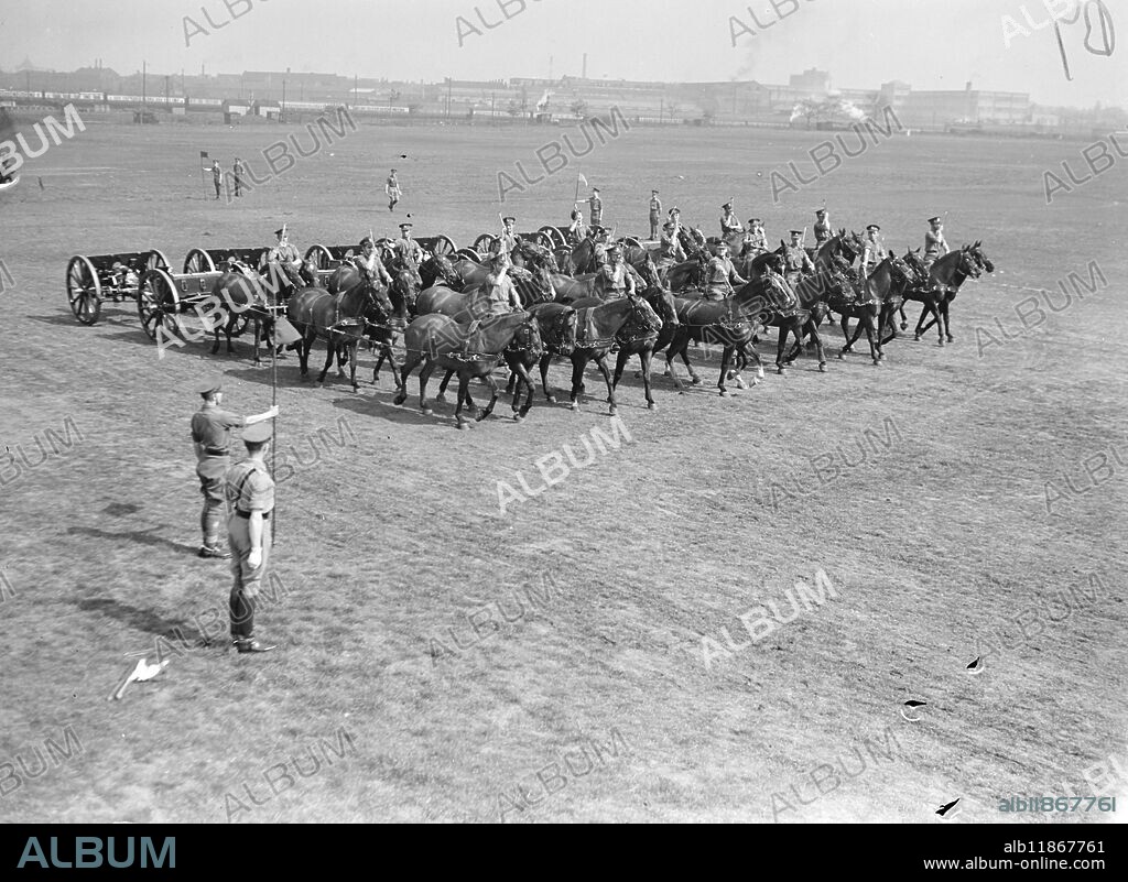 After an absence of 9 years, the thrilling Musical Drive returns to the Royal Tournament at Olympia. The spectacular drive, which consists of teams pulling guns and limbers weighing 1 1/2 tons, manoeuvering at the gallop in a 27 yard wide arena, has always been the highlight of the Tournament. Before the war it took two years to train men and horses who take part. Now the only horsed artillery unit in Britain, the King's Troop of the Royal Horse Artillery (Major J.A.Norman D.S.O) in reaching prefection, having been in training only since last November. Picture shows: The King's Troop, R.H.A., gave an object lesson in precision during rehearsal for the Musical Drive at Wormwood Scrubs today, (Tuesday). 20th April 1948.