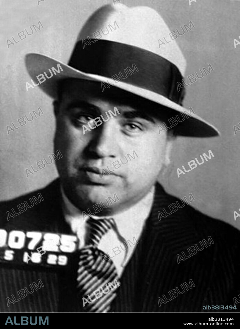 Capone mugshot, 1931. Alphonse Gabriel "Al" Capone (January 17, 1899 - January 25, 1947) was an American gangster. In his early 20s, he moved to Chicago and became bodyguard for Johnny Torrio, head of a criminal syndicate. Torrio retired and gave control to Capone who expanded the bootlegging business through increasingly violent means. Capone made donations to various charities and was viewed by many to be a "modern-day Robin Hood". The Saint Valentine's Day Massacre damaged Chicago's image, as well as Capone's, leading influential citizens to demand governmental action and newspapers to dub him; Public Enemy No. 1. The federal authorities prosecuted him for tax evasion in 1931, a federal crime and a novel strategy during the era. He was convicted and sentenced to 11 years in federal prison. He was already showing signs of syphilitic dementia early in his sentence, and he became increasingly debilitated before being released after eight years. He died in 1947, of cardiac arrest, at the age of 48.