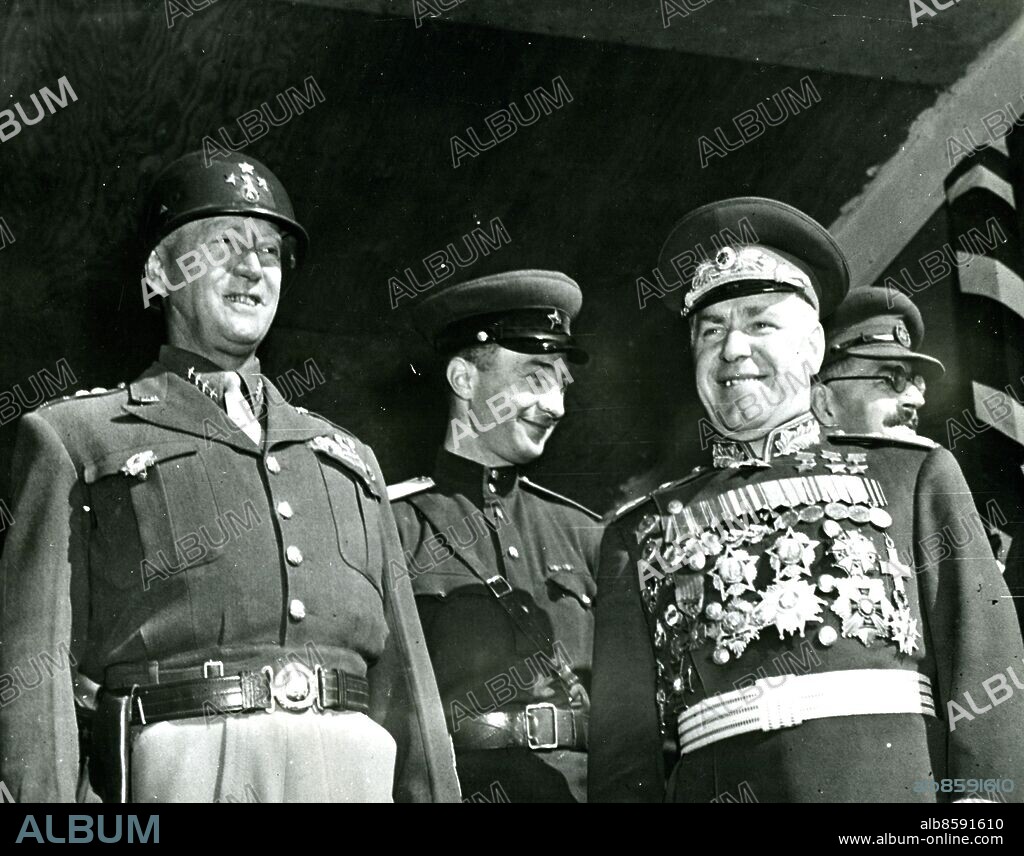 September 7, 1945 - US and Soviet Army Chiefs review voctory parade in Berlin - Gen. George S. Patton, Jr. and Marshal Gregory Zhukov (right) of the USSR, review Allied troops of four nations in Berlin. The parade was held to celebrate the Allied victory over Japan.