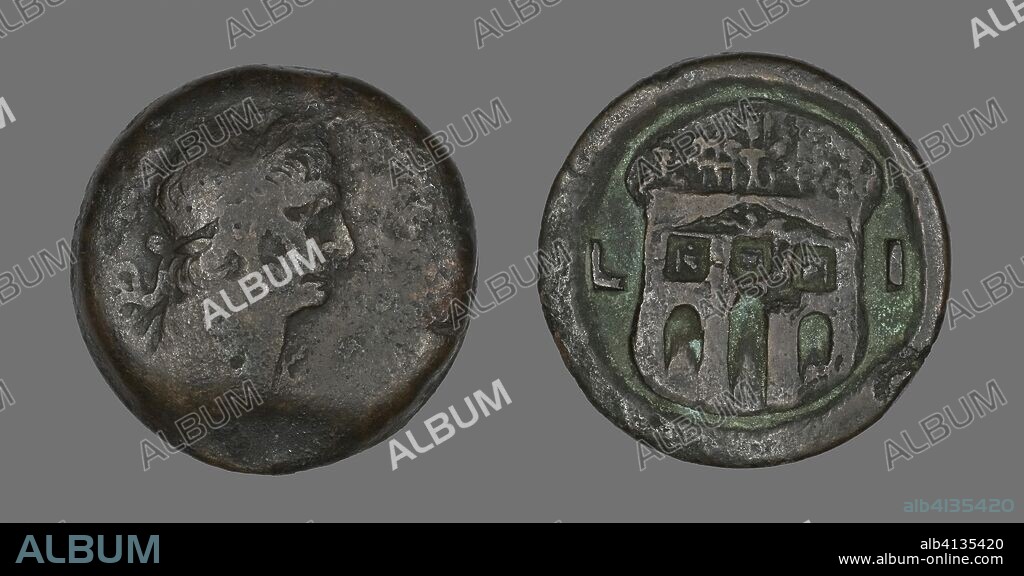 ANCIENT EGYPTIAN. Coin Portraying Emperor Trajan. Roman, minted in Alexandria, Egypt. Date: 98 AD-117 AD. Dimensions: Diam. 3.4 cm; 26.25 g. Bronze. Origin: Egypt.