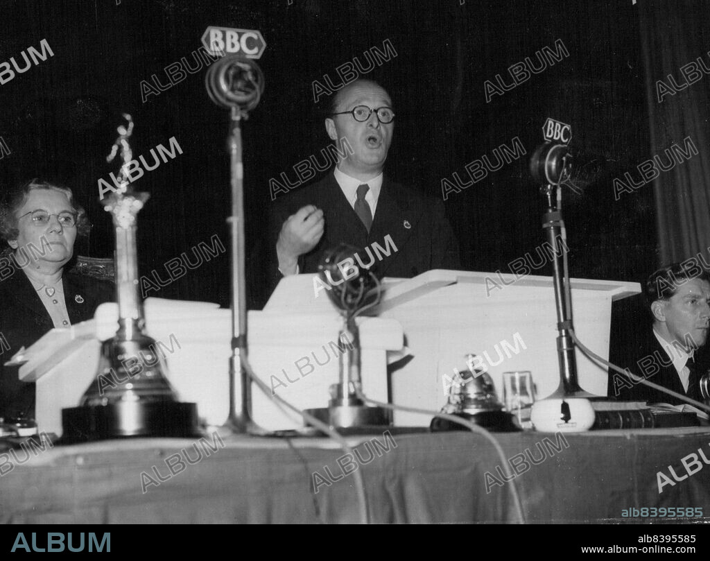General Secretary Addresses T.U.C. -- Mr. Vincent Tewson (General Secretary of the T.U.C.) addressing delegates at the 80th Trades Union Congress, here. He promised that the General Council would bring the utmost pressure to bear on the Government to secure a progressive reduction on prices and profits. On left is Miss Florence Hancock, Chairman of the T.U.C and right, Mr. Victor Feathers Assistant Secretary, T.U.C. September 10, 1948. (Photo by Planet News).