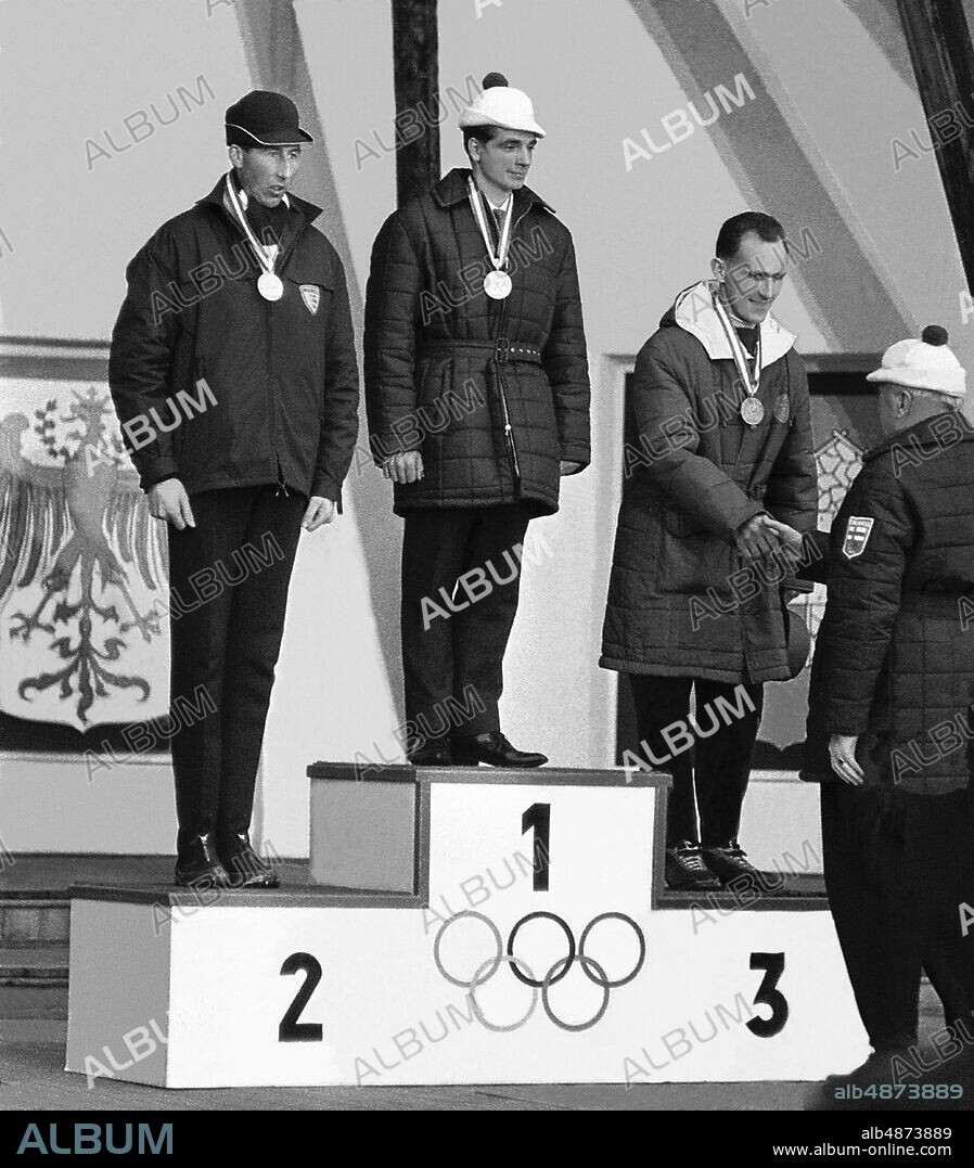 INNSBRUCK 1964-02-02. The Olympic medalists on skis 15 km during the Winter Olympics in Innsbruck. From left on the podium: Harald Grønningen Norway, silver, Eero Mäntyranta Finland, gold and Sixten Jernberg Sweden, bronze.. Photo: TT Historical / Code 1902.