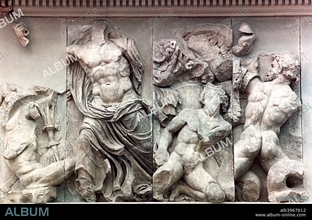 Detail from the Great Frieze of the Pergamon Altar, 180-159 BC. Zeus fighting the giants. The 113 metre long Ancient Greek frieze depicts the 'gigantomachy', the struggle between the gods and the giants. From the Pergamon Museum, Berlin, Germany.