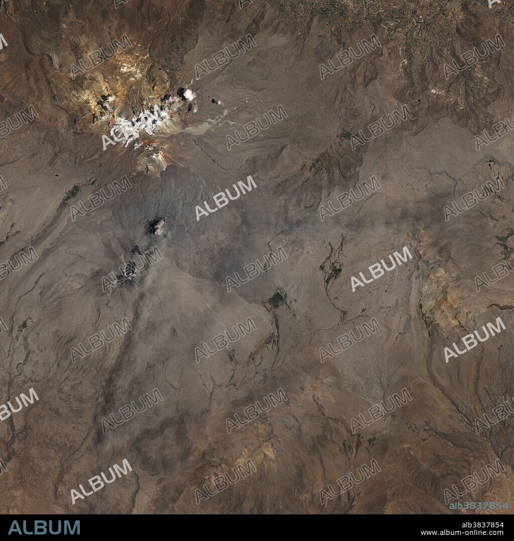 Sabancaya volcano in Peru, as seen by the Operational Land Imager (OLI) on the Landsat 8 satellite on November 19, 2016. A cloud of ash has spread over the area, darkening the snow on nearby Mount Ampato, a dormant volcano. Sabancaya is a stratovolcano, fueled by magma generated at the subduction zone between the Nazca and South American tectonic plates. It is one of the most active volcanoes in the Central Andes.