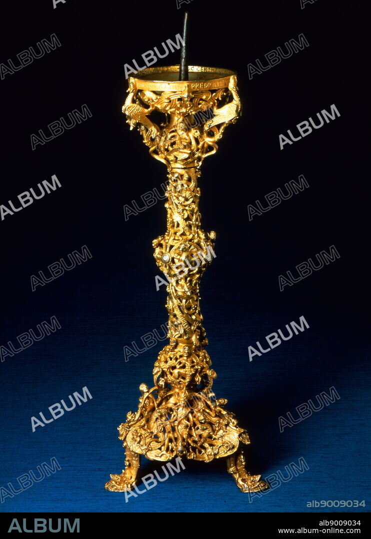 The Gloucester Candlestick. 1107-1113 AD. masterpiece of English metalwork in three sections, each separately cast by a process known as 'lost wax'. The decoration is formed of figures and apes interspersed between thick intertwining shoots of foliage.