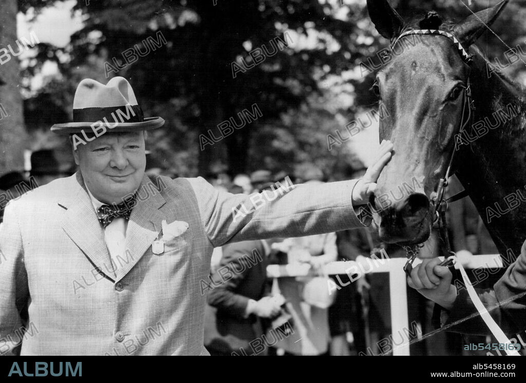 Well Done, Kid - Mr. Winston Churchill has a victory pat for his winning colt, Canyon Kid, after the race.Mr. Winston Churchill was at Windsor, Berkshire Races to-day (Wednesday) to see his new two-year-old Canyon Kid win its first race-the Speedy Stakes, over five furlongs.T. Gosling rode the colt to Victory, beating Lady de Trafford's Rasselas, W.H. Carr up, and Mr. Morry Levy's Mysterious Lad, with Gordon Richards in the Saddle. May 31, 1950. (Photo by Reuterphoto).