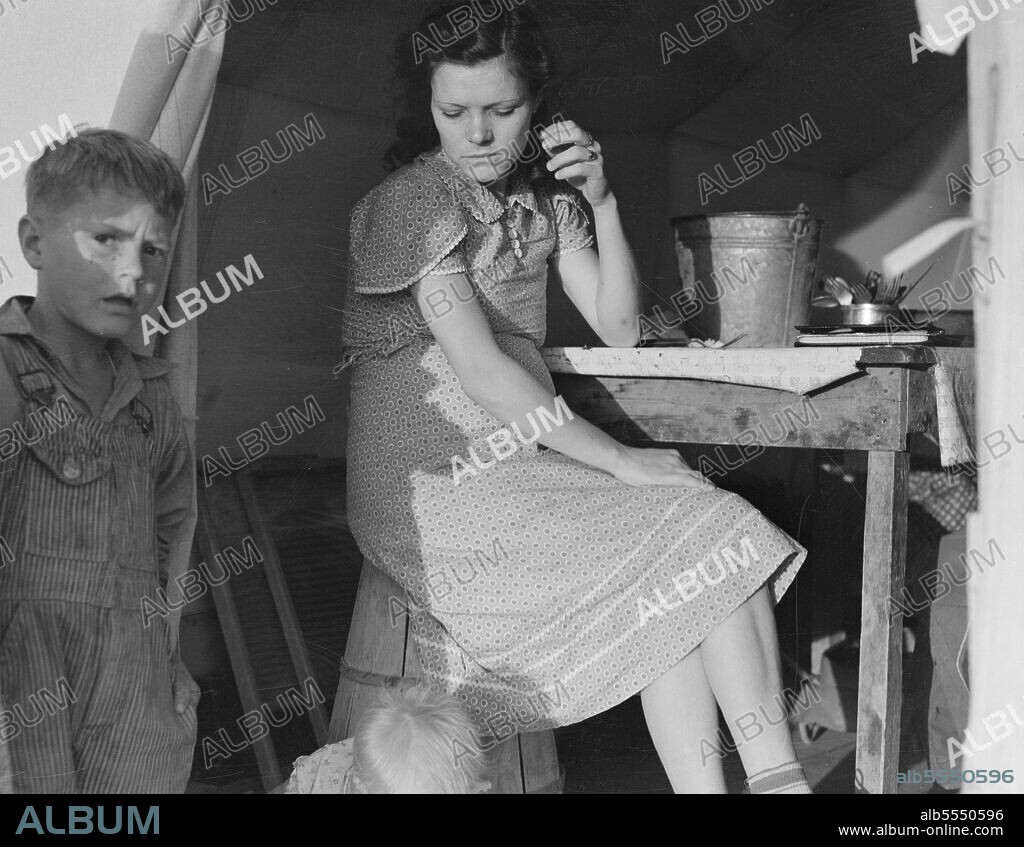 DOROTHEA LANGE. Calipatria, Imperial Valley, In Farm Security Administration (FSA) emergency migratory labor camp. Daughter of ex-tenant farmers on thirds and fourths in cotton. Had fifty dollars when set out. Went to Phoenix, picked cotton, pulled bolls made eighty cents a day with two people pulling bolls. Stayed until school closed. Went to Idaho, picked peas until August. Left McCall with forty dollars "in hand." Went to Cedar City and Parowan, Utah, a distance of 700 miles. Picked peas through September. Went to Hollister, California. Picked peas through October. Left Hollister for Calipatria for early peas which froze. Now receiving Farm Security Administration food grant and waiting for work to begin. "Back in Oklahoma, we are sinking. You work your head off for a crop and then see it burn up. You live in debts that you can never get out of. This isn't a good life, but I say that it's a better life than it was.".