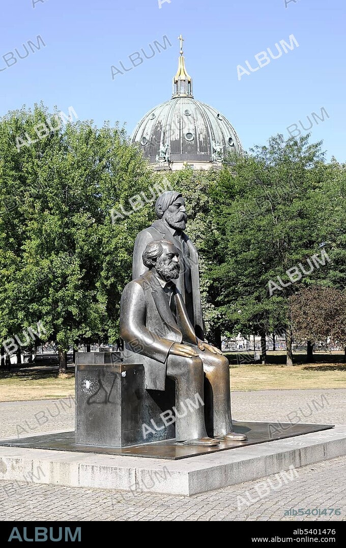 Karl Marx and Friedrich Engels monument, in the back the dome of the Berliner Dom cathedral, capital Berlin, Germany, Europe.