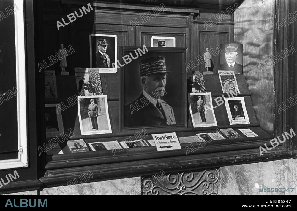 re: Petain, Philippe; French marshal and politician; 1856-1951. Portraits of Petain in a shop window. Photo, undated. From a series "La culte du Marechal Petain pendant la guerre 1939-1944".