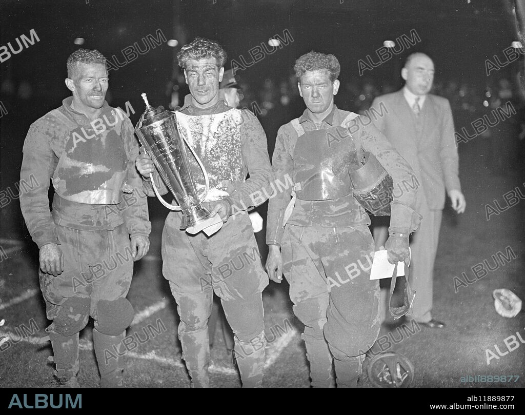 Lionel van Praag , the Australian international and Wembley captain became the first world ' s speedway champion at Wembley Stadium , London . At the end of 20 heats Van Praag and Eric Langton of Belle Vue , Manchester , tied with 26 points . Van Praag defeated Langton in the decider . Bluey Wilkinson of West Ham was third . Photo shows : Lionel van Praag ( centre ) with Eric Langton , runner - up ( left ) and Bluey Wilkinson , third , after the competition . 11 September 1936.