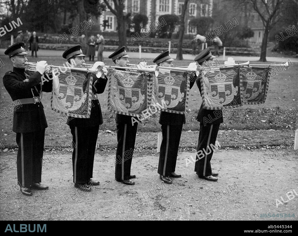 Commonwealth Coronation Fanfare In readiness for Coronation duties, trumpeters of Britain and the Commonwealth raise their instruments to sound a rousing fanfare at the Royal Military School of Music, Kneller Hall, Twickenham, Middlesex. Left to right - R. Rignold of Brisbane, Australia: H. Jeffrey (Toronto, Canada): J. Emmott (Bradford): D. Cole (Reading): and R.A.Y. Mitchell (Arbreath) all are student band-masters at Kneller Hall. January 29, 1953. (Photo by Reuterphoto).