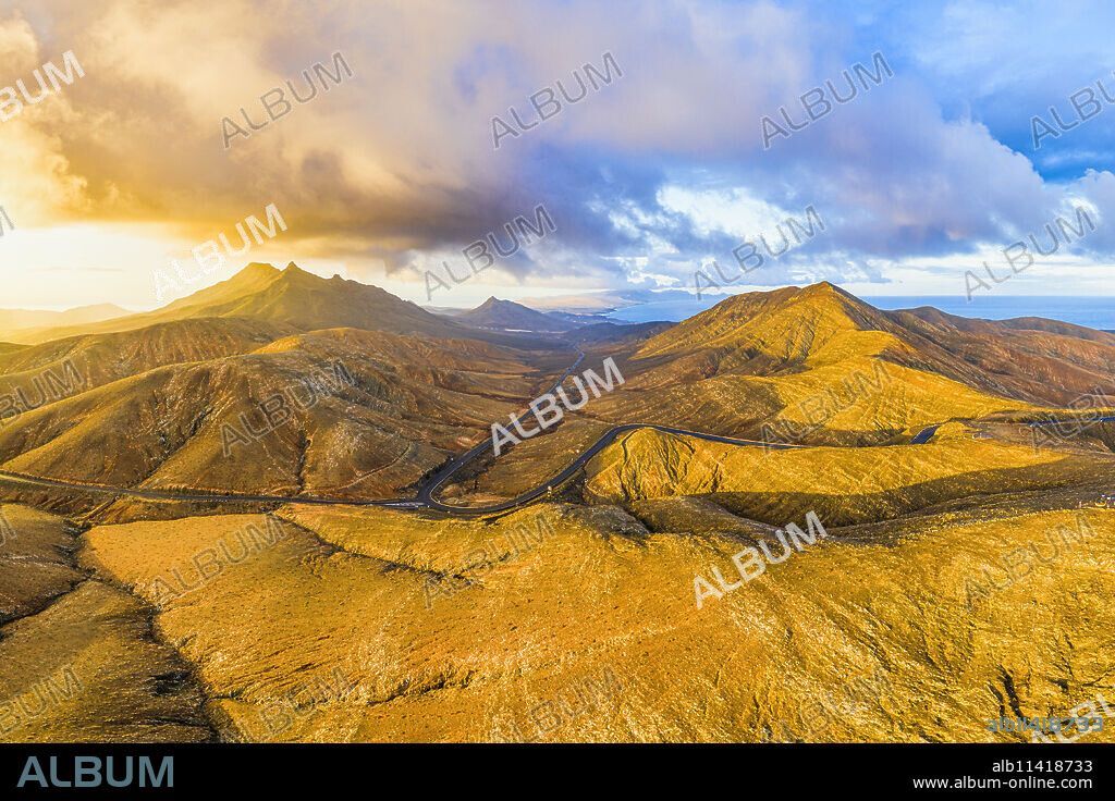 Mountain road crossing the volcanic landscape near Sicasumbre astronomical viewpoint, Fuerteventura, Canary Islands, Spain, Atlantic, Europe.