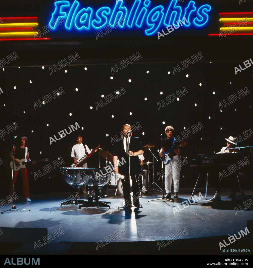 Flashlights, ZDF Pop Show, TV performance by the German-British rock band Lake with singer Ian Cussick, 1984. Flashlights, ZDF Pop show, TV performance by the German-British rock band Lake with singer Ian Cussick, 1984.