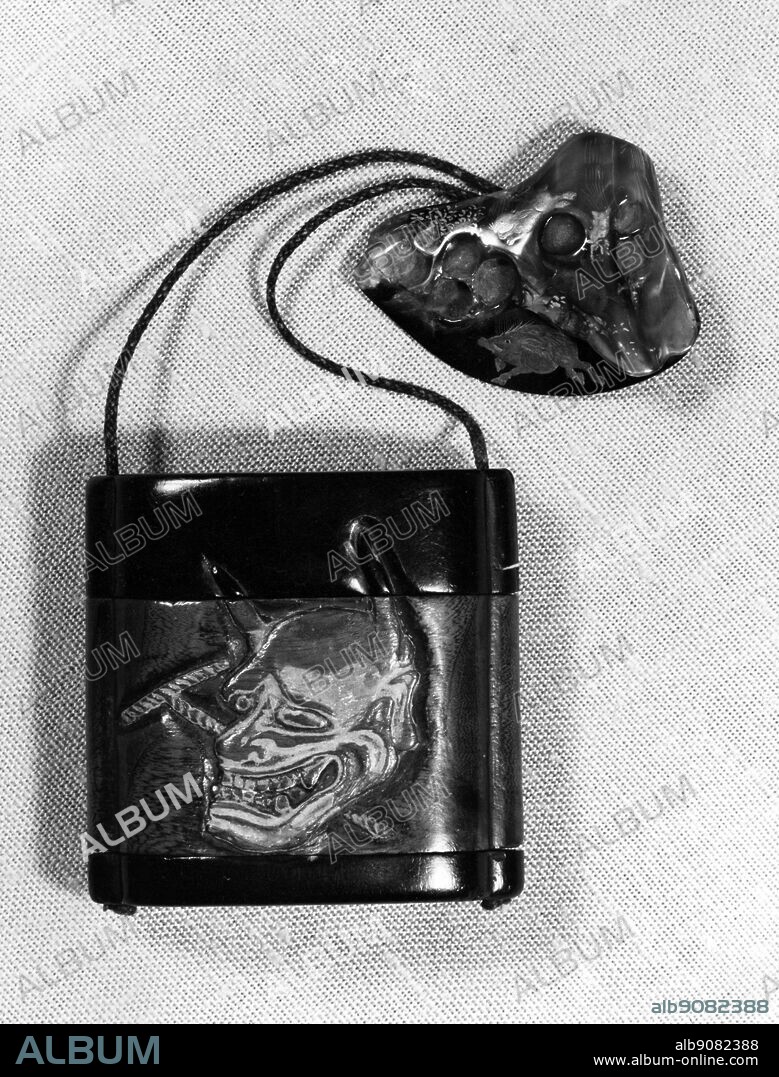 Japanese artifacts : Tobacco box - ton-kotsu , signed Shu-Zan ; tortoiseshell netsuke of Mount Fuji with a wild boar in lacquer. W W Winkworth Collection.