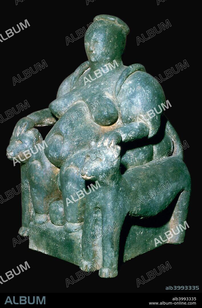 Clay sculpture of a mother-goddess from Catal Huyuk, Turkey on a leopard throne giving birth.