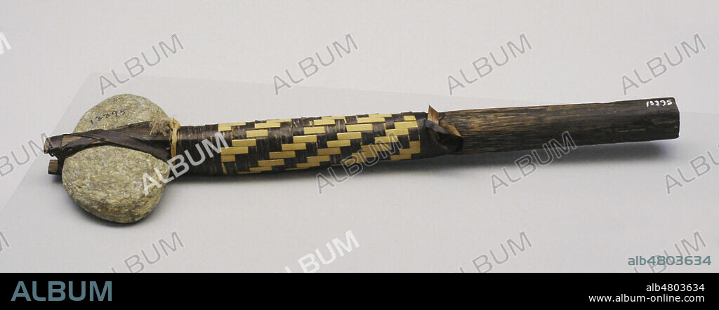 Head-breaker used as a blunt weapon. Wood, stone and plant fiber. Karaja indians. Bananal Island, Brazil. Museum of the Americas. Madrid, Spain.