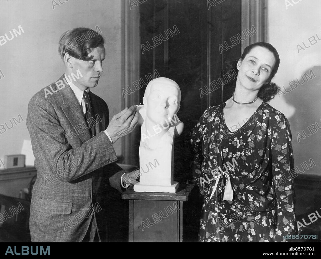Orig. bildtext... POSING FOR HER BUST. Ronny Johansson, the well-known Swedish dancer who has been acclaimed both here and in Europe as the foremost exponent and creator of the humoruos dance, poses for a bust by the Swedish sculptor, Wilhelm Henning at his New York studios. Orig. bildtext... SKULPTUR AV RONNY JOHANSSON. Den kända svenska danskonstnärinnan Ronny Johansson, som med sin konst vunnit stora framgångar såväl i Europa som i Amerika, poserar här för den svenske skulptören Wilhelm Henning i New York. Anm. W Henning, 1899-1955, svensk skulptör R Johansson, 1891-1979, svensk dansös Byster Trio CD414 persons: RONNY JOHANSSON;WILHELM HENNING sites: SVERIGE*;NEW YORK;USA.