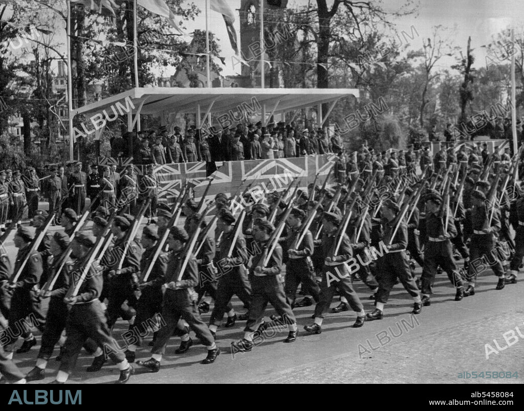 Mr. Churchill Takes Salute At Great Berlin Victory Parade - Men of the 7th Armoured division, the famous "Desert Rats" who fought their way through from El Alamein, march past the saluting base.Mr.Winston Churchill took the salute at a great British victory parade in the heart of Berlin. when 10,000 men from the fighting services merched along the charlottenburger Chaussee, the broad highway which cuts through Berlin's Tiergarten. July 23, 1945.