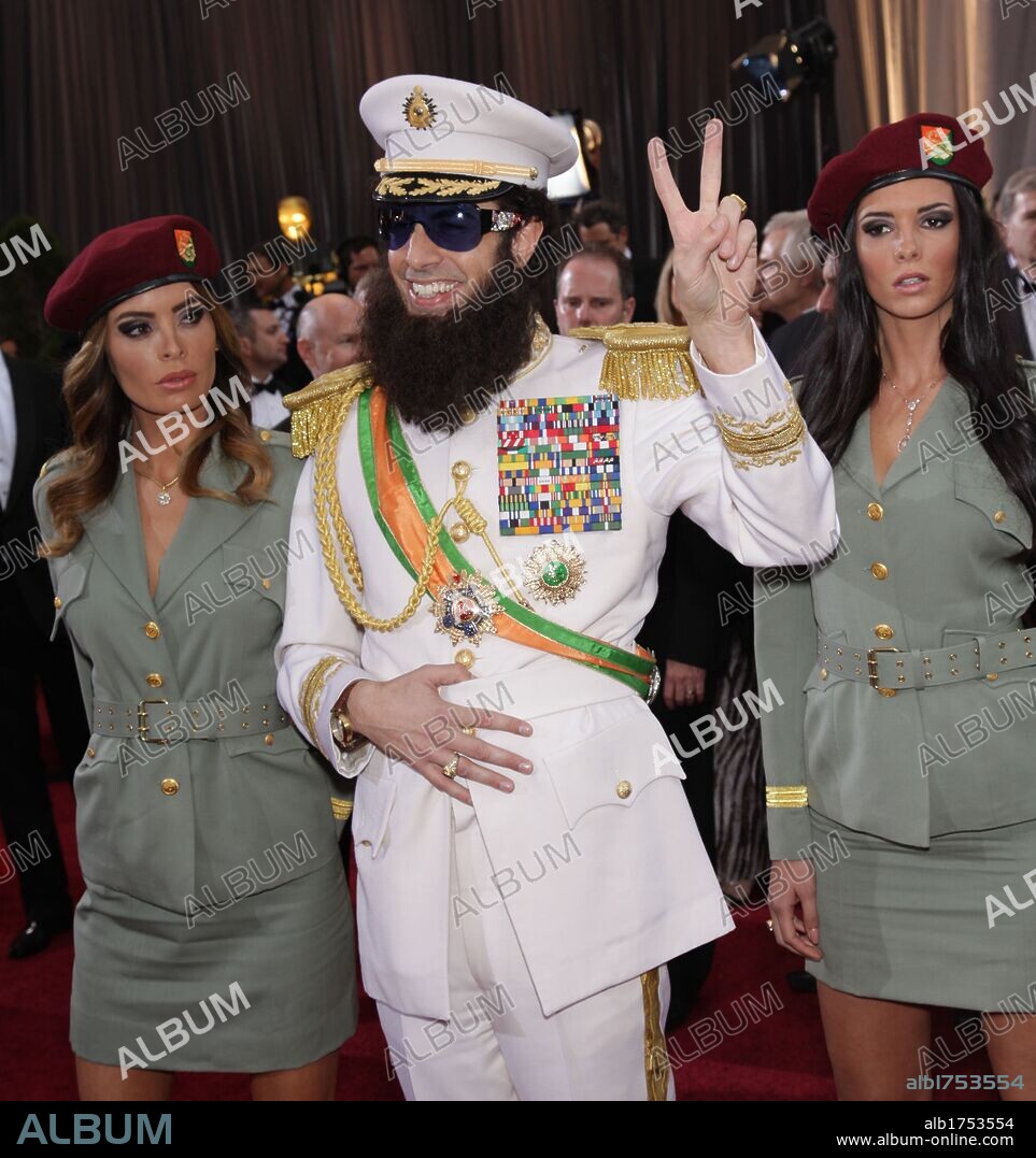 Feb. 26, 2012 - Hollywood, California, U.S. - SACHA BARON COHEN dressed as The 'Dictator' says he is wearing John Galliano and Kmart socks and carrying an urn with Kim Jong-il and followed by his 'bodyguards' on the Oscar red carpet at the 84th Academy Awards, The Oscars, in front of Kodak Theatre. 26/02/2012