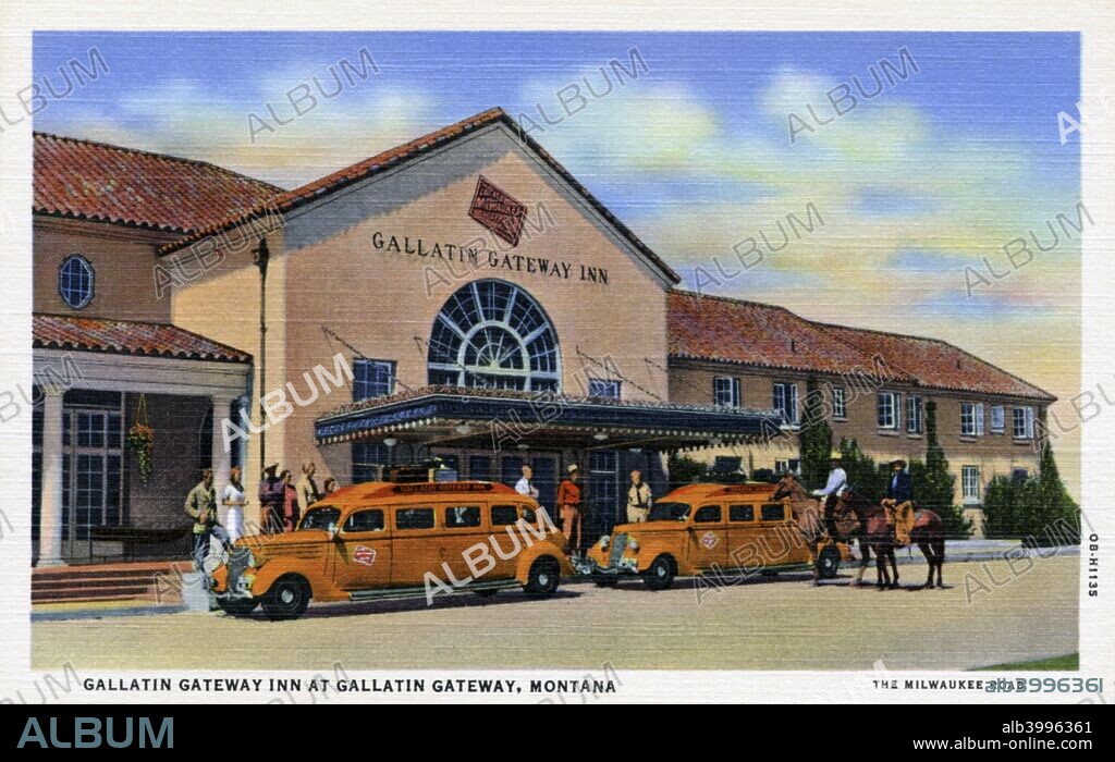 Gallatin Gateway Inn, Montana, USA, 1940. Postcard. Two orange touring buses parked in front. Visitors stand on the inn's veranda and two men sit on horses.