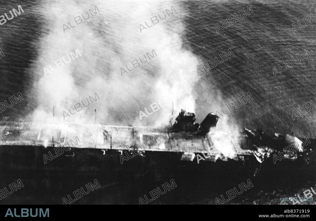 Hiryu ('Flying Dragon') was an aircraft carrier built for the Imperial Japanese Navy (IJN) during the 1930s. The only ship of her class, she was built to a modified Soryu design. Her aircraft supported the Japanese invasion of French Indochina in mid-1940. During the first month of the Pacific War, she took part in the attack on Pearl Harbor and the Battle of Wake Island. The ship supported the conquest of the Dutch East Indies in January 1942. The following month, her aircraft bombed Darwin, Australia, and continued to assist in the Dutch East Indies campaign. In April, Hiryu's aircraft helped sink two British heavy cruisers and several merchant ships during the Indian Ocean raid.<br/><br/>. After a brief refit, Hiryu and three other fleet carriers of the First Air Fleet (Kido Butai) participated in the Battle of Midway in June 1942. After bombarding American forces on the atoll, the carriers were attacked by aircraft from Midway and the carriers USS Enterprise, Hornet, and Yorktown. Dive bombers from Yorktown and Enterprise crippled Hiryu and set her afire. She was scuttled the following day after it became clear that she could not be salvaged. The loss of Hiryu and three other IJN carriers at Midway was a crucial strategic defeat for Japan and contributed significantly to the Allies' ultimate victory in the Pacific.