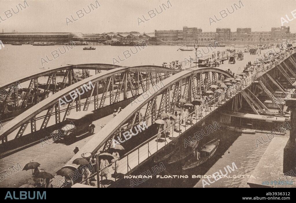 'Howrah Floating Bridge, Calcutta', 1905. Howrah Bridge, a pontoon bridge over the Hooghly River in West Bengal, India. The Government of Bengal passed the Howrah Bridge Act in the year 1871 under the Bengal Act IX of 1871. A contract was signed with Bradford Leslie (1831-1926) to construct a pontoon bridge. Parts of the bridge were constructed in England and shipped to Calcutta, where they were assembled. The bridge was completed in 1874. [The Commercial Union, Calcutta, c1905].