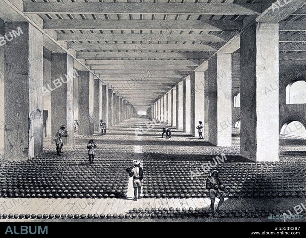 After balling, the balls are taking to the Drying Room, where each is placed in an individual earthenware cup. The image shows men examining the balls, and puncturing with a sharp style those in which gas, arising from fermentation, may be forming'.