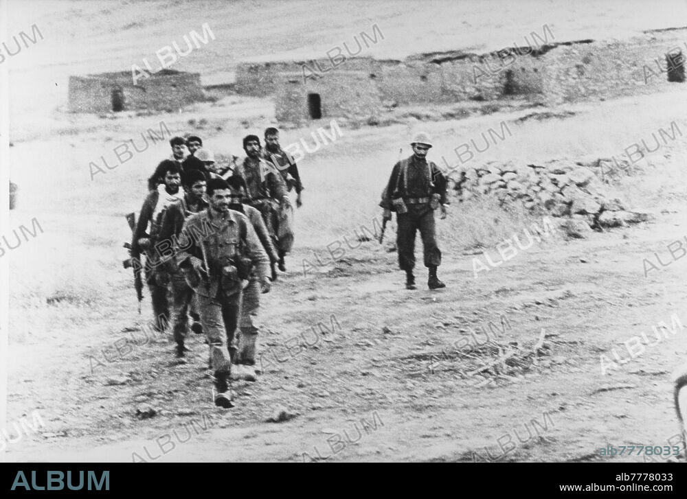 Iran-Iraq war (22.09.1980 - 20.08.1988) / Battle of Khorramshahr / destruction of the war. The city of Khorramshahr in Iran, located about 40 kilometers southeast of Basra in Iraq, has been at the center of events since the beginning of the war. The Battle of Khorramshahr, which lasted seven weeks from September 22 to November 10, 1980, left a ghost town that was renamed "Khuninshahr" meaning "City of Blood." A group of Iranian soldiers cross the field in the Khorramshahr region. Photo, 02.10.1980.