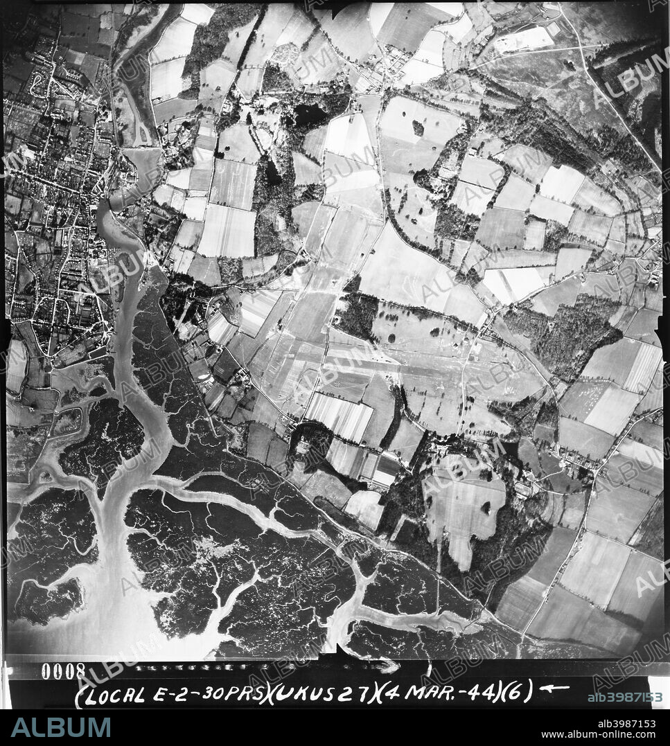 RAF Lymington, Hampshire, 1944. Opened before D-Day in 1944 it was a prototype for temporary landing fields used across France in WW2. The airfield was used by RAF, RCAF and US units including USAAF 50th Fighter Group, but was closed down in 1946. Photographed by the USAAF Photographer.